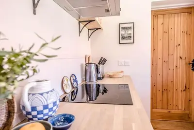 a kitchen with a counter with a stove top oven at The Studio, Hoo in Woodbridge