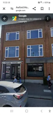a car parked in front of a building at leigh Penthouse Apartment in Leigh-on-Sea