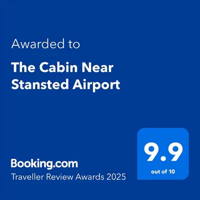 a blue sign with the text awarded to the cabin nearin near stranded airport at The Cabin Near Stansted Airport in Little Hallingbury