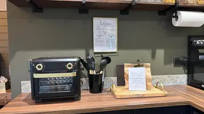 a kitchen counter top with a toaster oven and a counter top with a counter at The Cabin Near Stansted Airport in Little Hallingbury