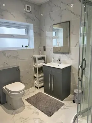 a bathroom with a toilet and a sink and a shower at Luxury Retreat Beach House - Sleeps 6 in Southend-on-Sea