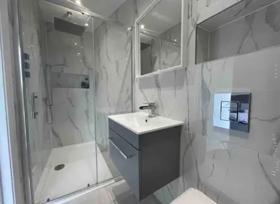 a bathroom with a sink and a shower and a toilet at Large Countryside House Swim Pool Jacuzzi Sleeps 10 guest in Ware