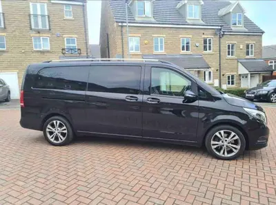 a black van parked in a brick parking lot at Large Countryside House Swim Pool Jacuzzi Sleeps 10 guest in Ware