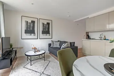 a living room with a couch and a table at Tailored Stays - Central Cambridge, River Walk Apartments in Cambridge