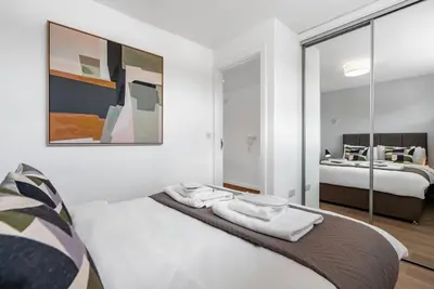 a bedroom with a bed with towels on it at Tailored Stays - Central Cambridge, River Walk Apartments in Cambridge