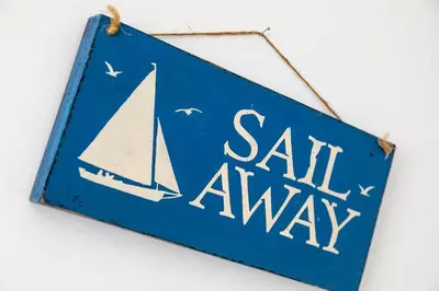 a blue sign with a sail away on it at Shore House - Walton in Walton-on-the-Naze