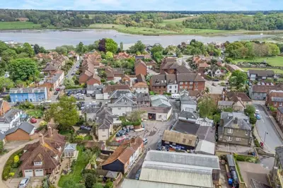 an aerial view of a town with a river at Curlew Cottage Woodbridge Suffolk Cosy Victorian cottage for couple and dog in Woodbridge