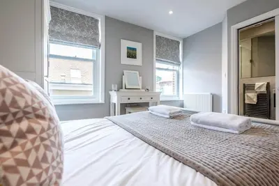 a bedroom with a bed with two pillows on it at Lyndhurst, Aldeburgh in Aldeburgh