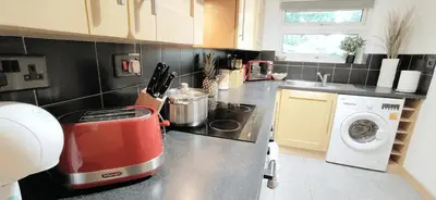a kitchen with a red appliance on a counter at 2 Single Beds, 1 BR Apartment in Newmarket