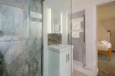 a bathroom with a sink and a shower at Primrose Cottage, Leiston, near Sizewell, Thorpeness and Aldeburgh - Managed by Aldeburgh Coastal Cottages in Leiston