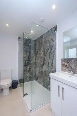 a bathroom with a shower and a toilet and a sink at Primrose Cottage, Leiston, near Sizewell, Thorpeness and Aldeburgh - Managed by Aldeburgh Coastal Cottages in Leiston