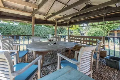 a wooden table and chairs on a patio at Number 27, Alderton in Woodbridge