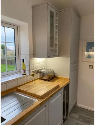 a kitchen with a counter with a sink and a window at Near Woodbridge The Annexe Eyke Fantastic views with Dog secure Garden and Paddock in Eyke