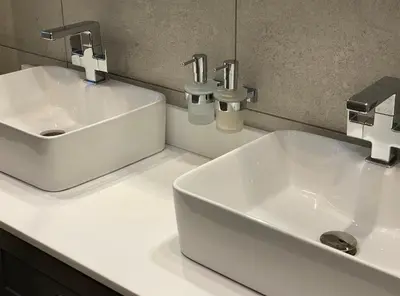 a bathroom with two sinks and two faucets at Near Woodbridge The Annexe Eyke Fantastic views with Dog secure Garden and Paddock in Eyke