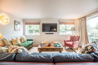 a living room with a couch and a table at The Old Forge, Great Glemham in Great Glemham