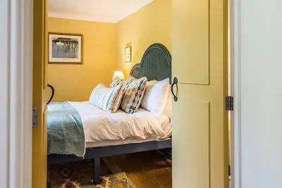 a bedroom with a bed with pillows on it at The Old Forge, Great Glemham in Great Glemham