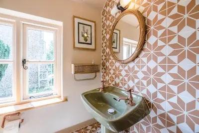 a bathroom with a sink and a mirror at The Old Forge, Great Glemham in Great Glemham