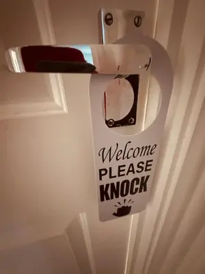 a door with a welcome please knock sign on it at Chez Ana in Saxmundham
