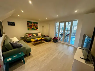 a living room with a couch and a table at Chez Ana in Saxmundham