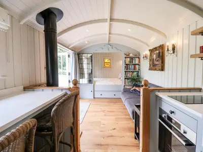 a kitchen and living room with a stove at Utopia in Harleston