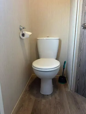 a bathroom with a white toilet in a room at Seawick Caravan 922 in Clacton-on-Sea