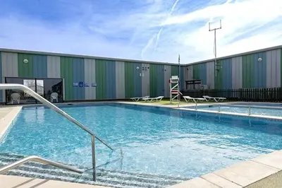 a large swimming pool in front of a building at Seawick Caravan 922 in Clacton-on-Sea