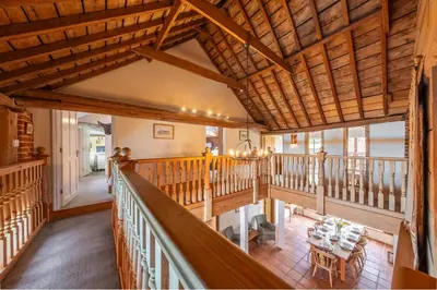 an overhead view of a living room with wooden ceilings at Semer Barn in Semer