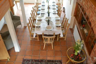 an overhead view of a long dining room table with chairs at Semer Barn in Semer