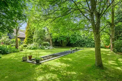 a park with green grass and a tree at Attractive 2 storey, 2 bedroom barn in Long Melford in Long Melford