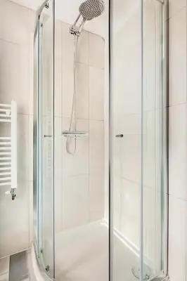 a shower with a glass door in a bathroom at Nice 2 bedroom house in Stowmarket in Stowmarket