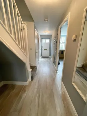 a hallway of a home with stairs and a door at Vibrant Mill Road Oasis - Peaceful House with Garden near station in Cambridge
