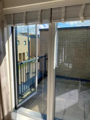 a view from a window of a balcony at Homely & Warm Trumpington House w Parking, 5 mins drive to Bio Medical Campus, Addenbrooke's & Papworth hospitals in Cambridge