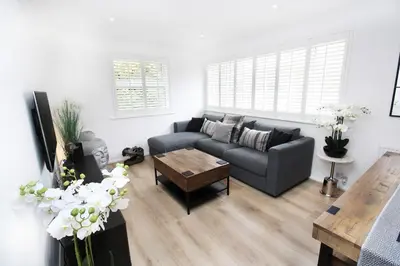 a living room with a couch and a coffee table at Modern and Cosy Flat For 4 in Cherry Hinton