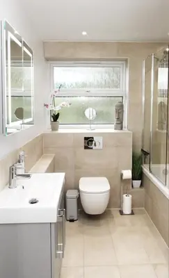 a bathroom with a toilet and a sink and a window at Modern and Cosy Flat For 4 in Cherry Hinton