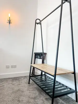 a wooden swing in a room with a table at Dog and Whistle Pub in Hertford