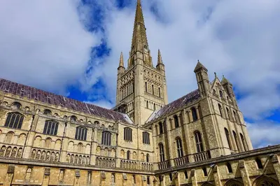 a large cathedral with a tower and a steeple at The Lodge - 2 acres of garden with hot tub and fire pit and BBQ in East Harling