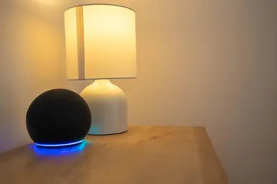 a lamp sitting on top of a wooden table at Boho Style - KING BED, Central, Super FAST Wi-Fi in Cambridge