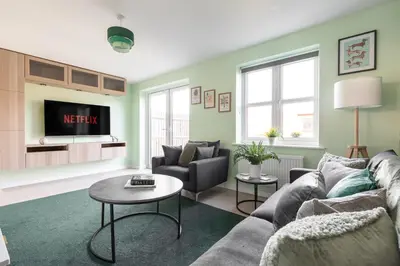 a living room with a couch and a table at Weekly & Monthly Rates! Stunning Home By Stansted Airport in Bishops Stortford