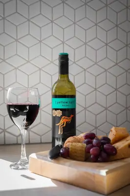 a bottle of wine next to a glass of red wine at Weekly & Monthly Rates! Stunning Home By Stansted Airport in Bishops Stortford