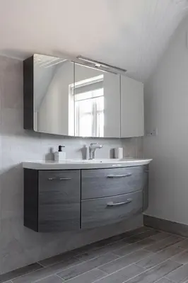 a bathroom with a sink and a mirror at Weekly & Monthly Rates! Stunning Home By Stansted Airport in Bishops Stortford