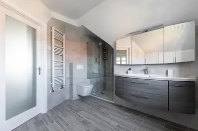 a bathroom with a sink and a shower and a toilet at Weekly & Monthly Rates! Stunning Home By Stansted Airport in Bishops Stortford