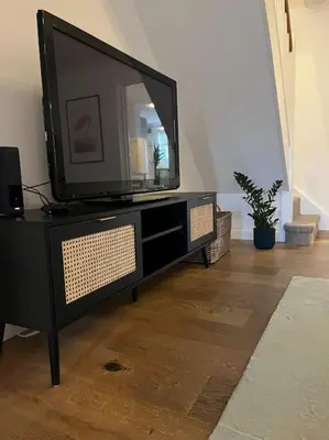 a flat screen tv sitting on top of a dresser at Chic 2 bedroom cottage in Willingham
