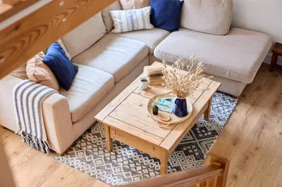 a living room with a couch and a coffee table at Entire 2 bed coach house in peaceful Norfolk village in Pulham