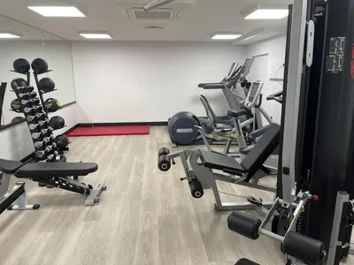 a gym with several treadmills and machines at Seaside Luxury Retreat in Southend-on-Sea