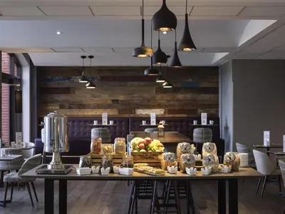 a table with food on it in a restaurant at Novotel Ipswich Centre in Ipswich