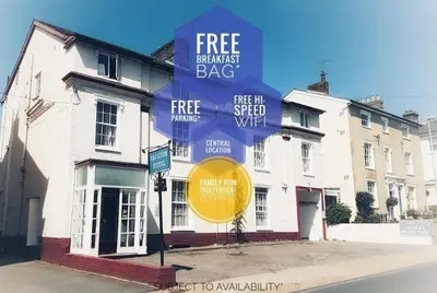 a sign that reads free breakfast bag on a building at The Carlton Hotel in Ipswich