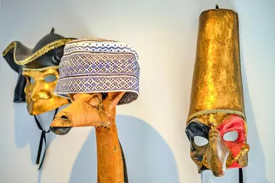 a pair of masks and a hat hanging on a wall at Finest Retreats - Kings Wharf - Luxury Riverside Home in Burnham on Crouch