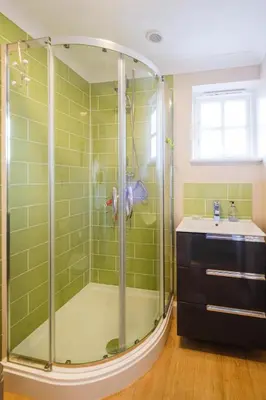 a bathroom with a shower and a sink at 8 Saxonfields in Snape