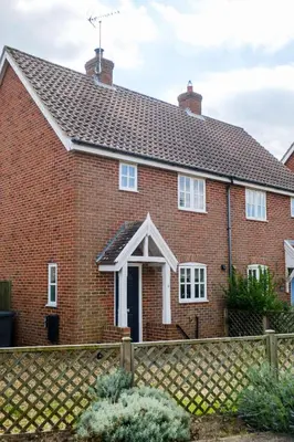 a red brick house with a white roof at 8 Saxonfields in Snape