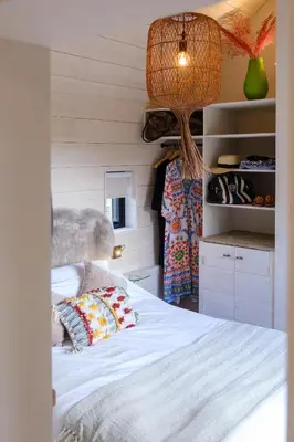 a bedroom with a bed in a room with a closet at Mission Lodge in Thorpeness